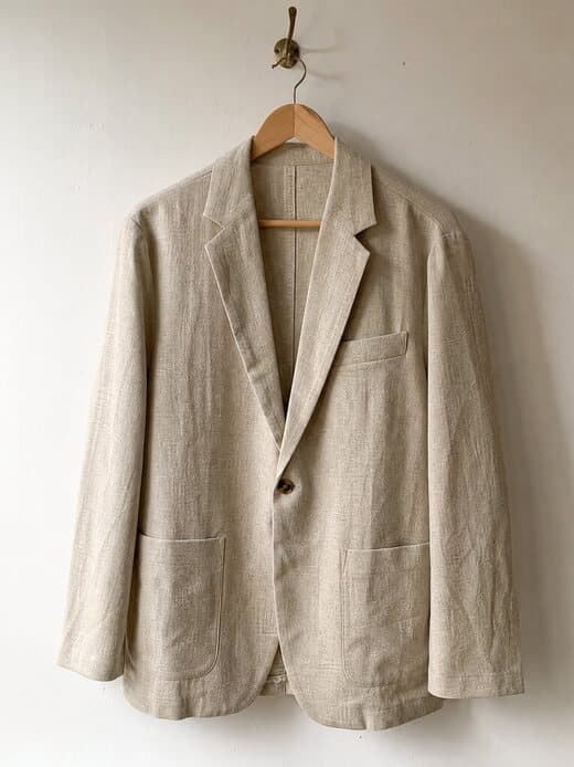The sand linen blazer on a hanger — the single source photo